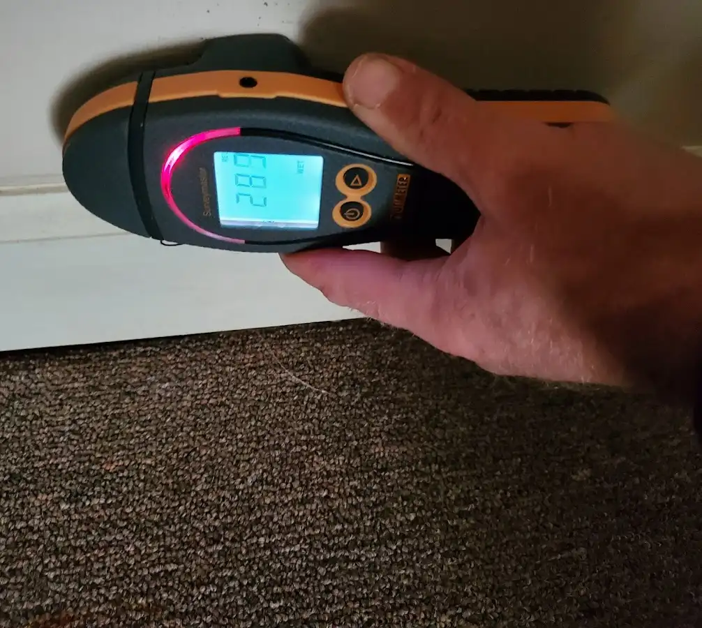 Moisture detection at baseboard during Storm Damage Restoration in Ocean City